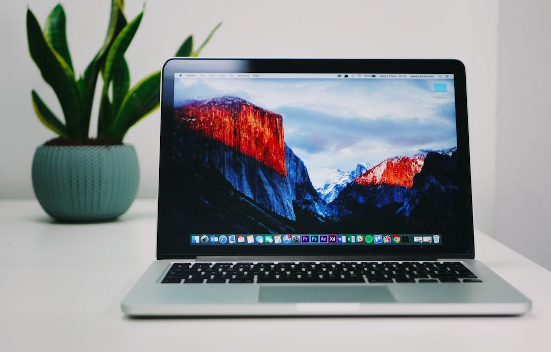 Professional website development workspace with laptop