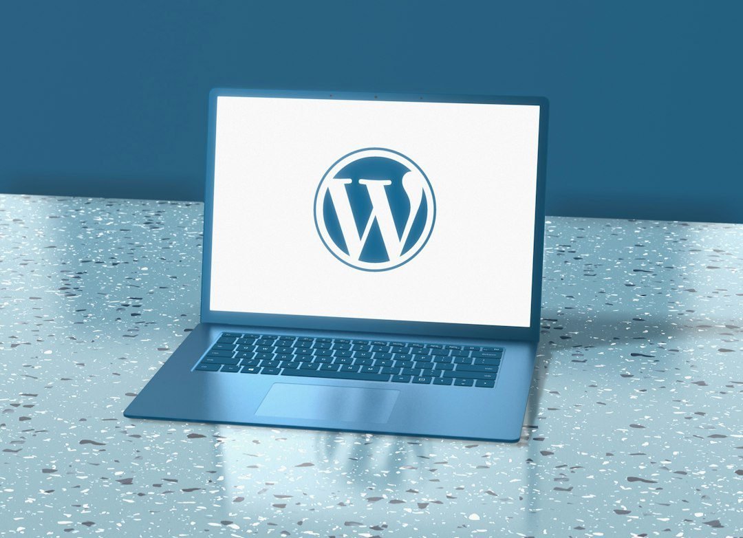 WordPress website development workspace with laptop